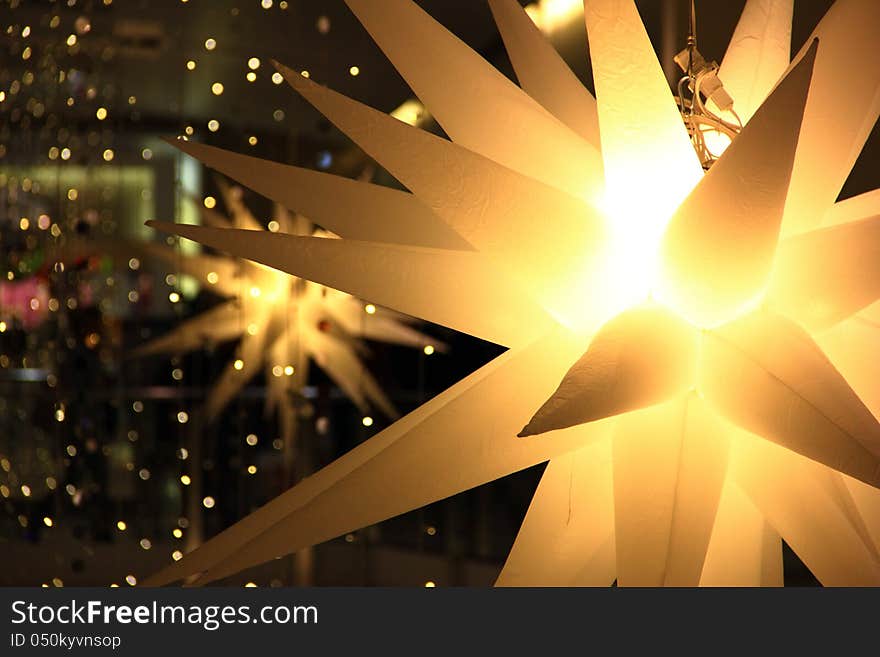 Christmas Snow spikes with lights in the backdrop. Christmas Snow spikes with lights in the backdrop