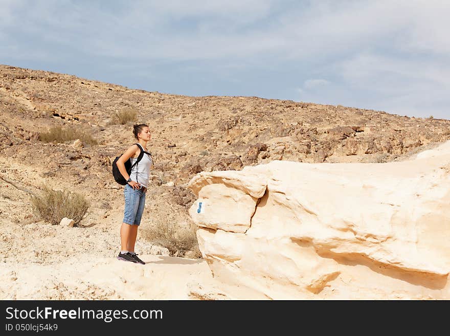 Girl wandering the desert mountains. Girl wandering the desert mountains