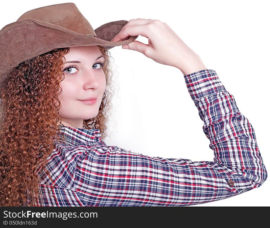 Portrait of curly girl in a cowboy hat