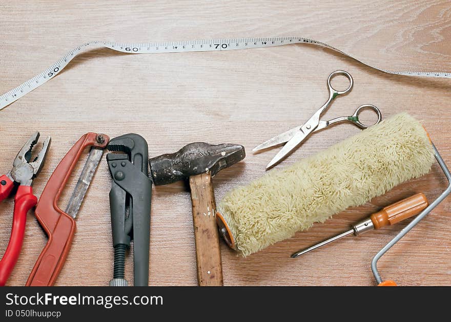 Old tools lying on a wooden surface