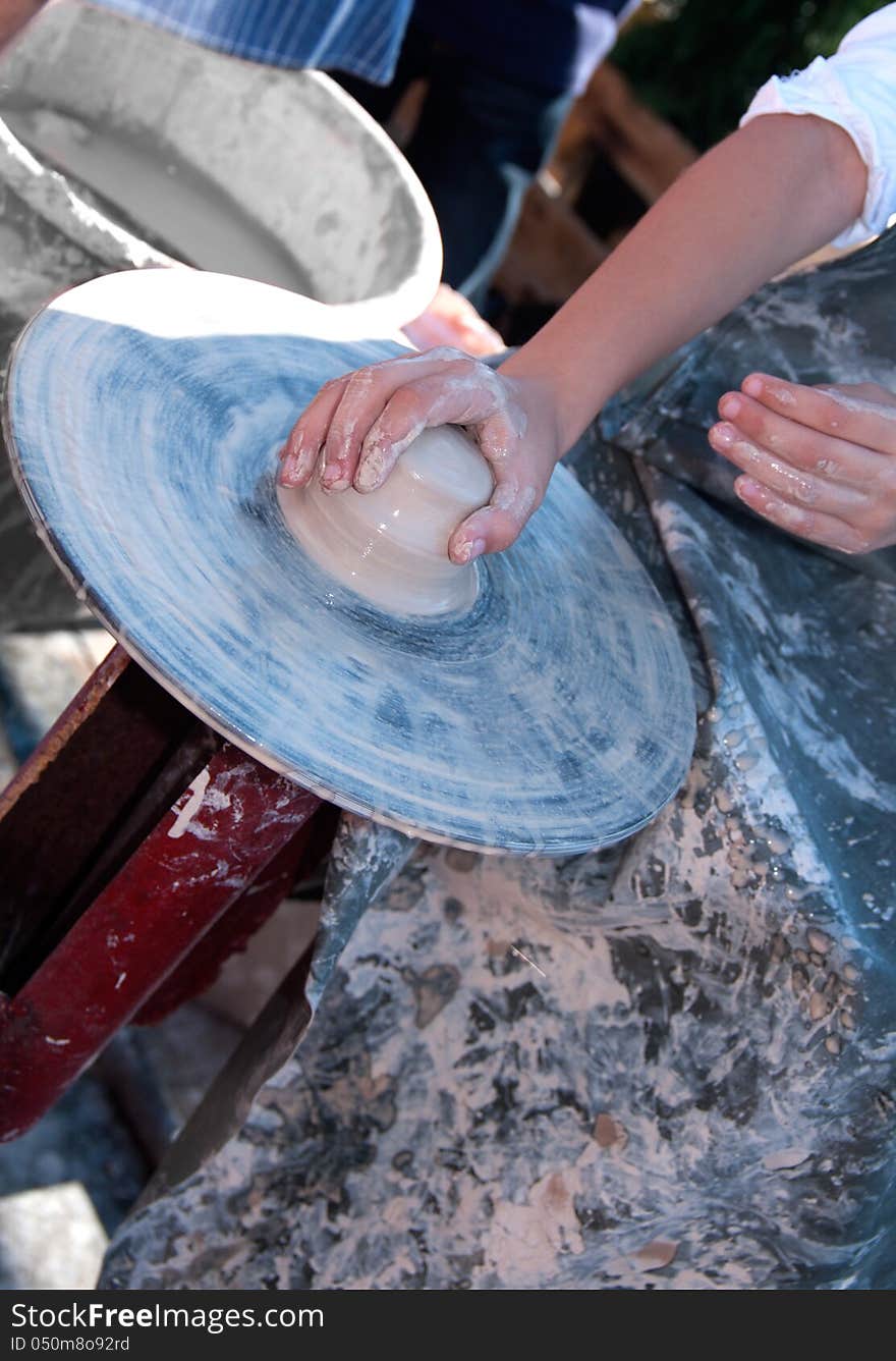 Child makes a product of clay