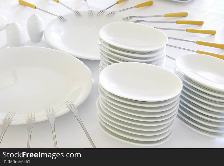 Empty white plates with forks. Empty white plates with forks