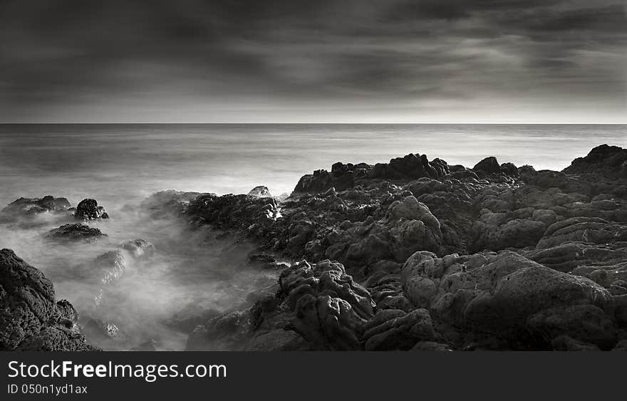 Exposure of a coastal tide surging through a cove. Exposure of a coastal tide surging through a cove.