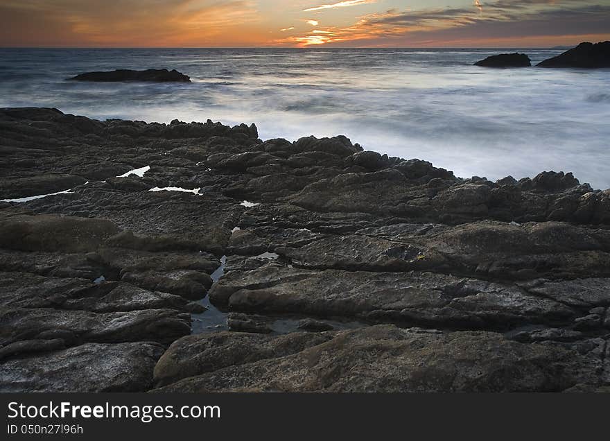 Exposure of a coastal tide surging through a cove. Exposure of a coastal tide surging through a cove.