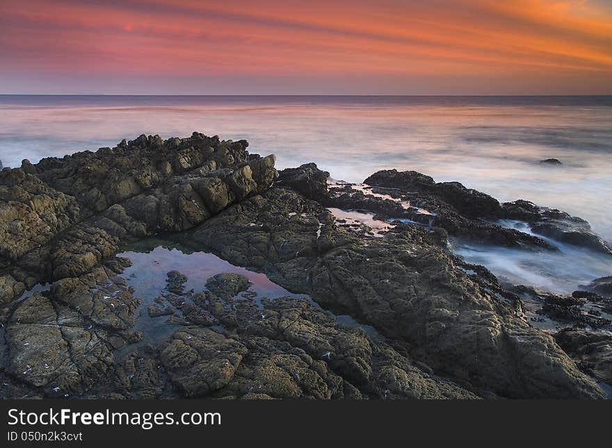 Exposure of a coastal tide surging through a cove. Exposure of a coastal tide surging through a cove.