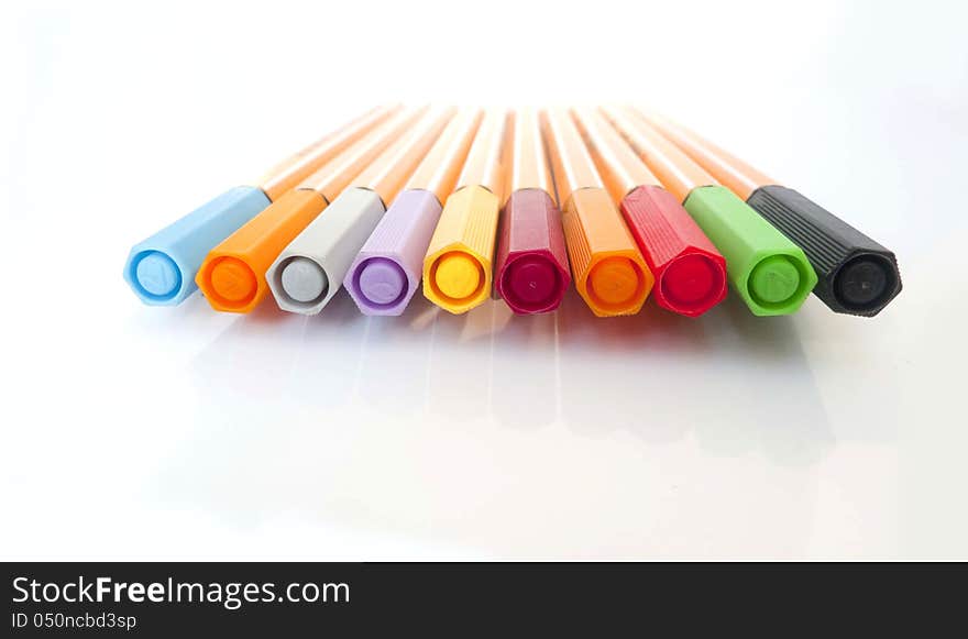 Colorful markers pens on White Background .