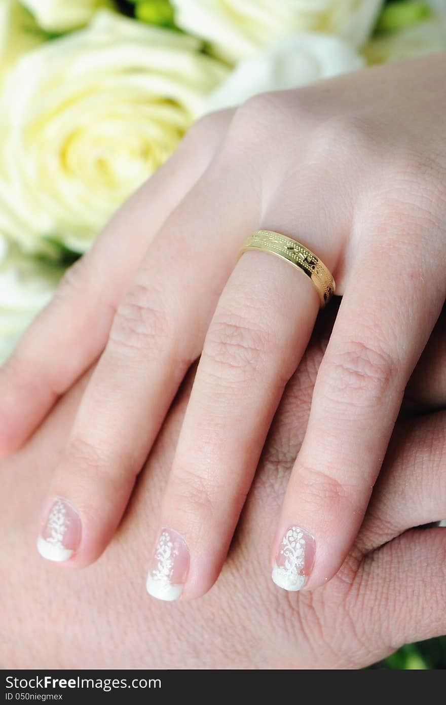 Wedding hands and golden rings