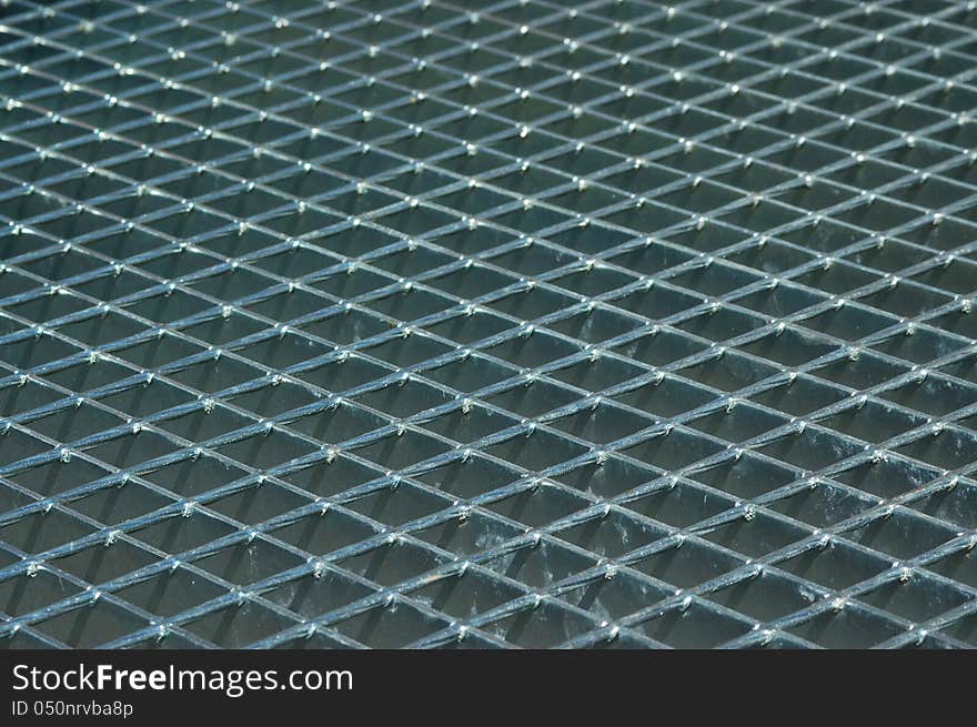 Metal grid on floor stairwell