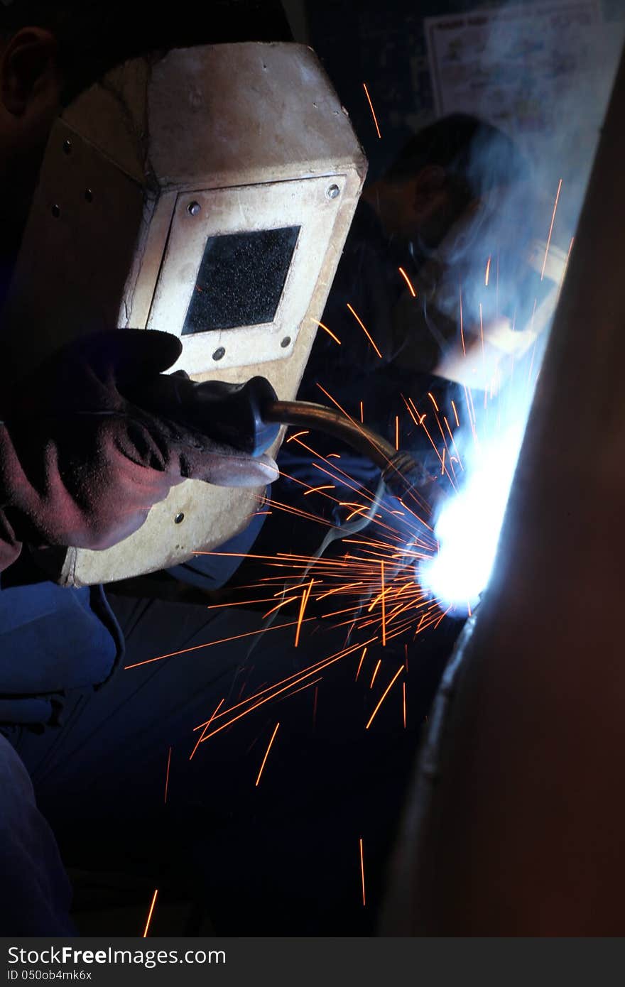 Welders worker in the factory