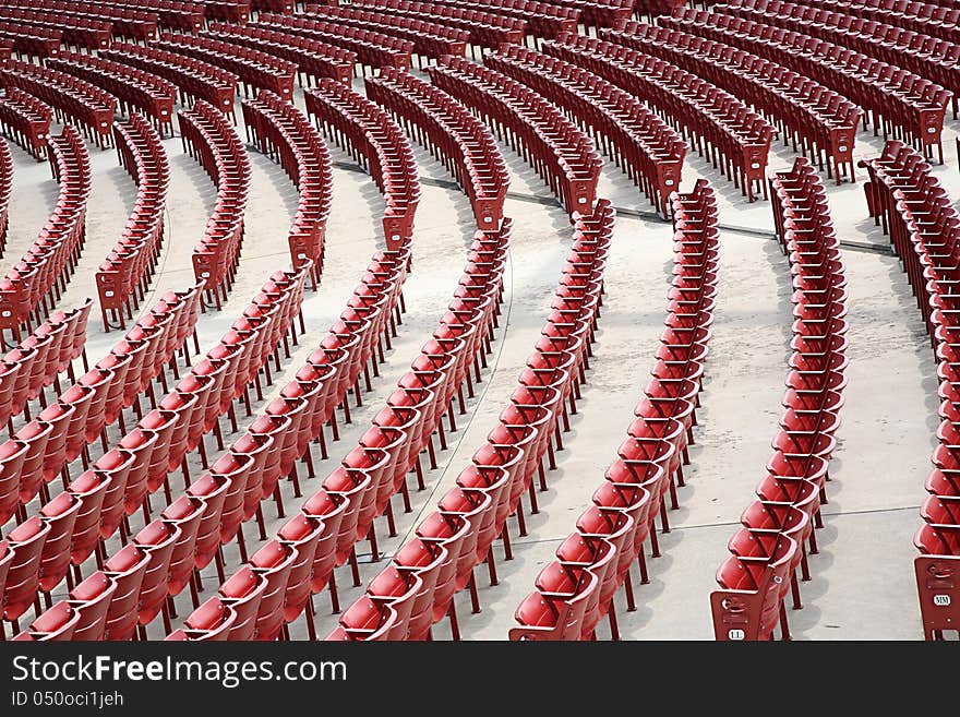 Empty red seats in an auditorium in the open air. Empty red seats in an auditorium in the open air