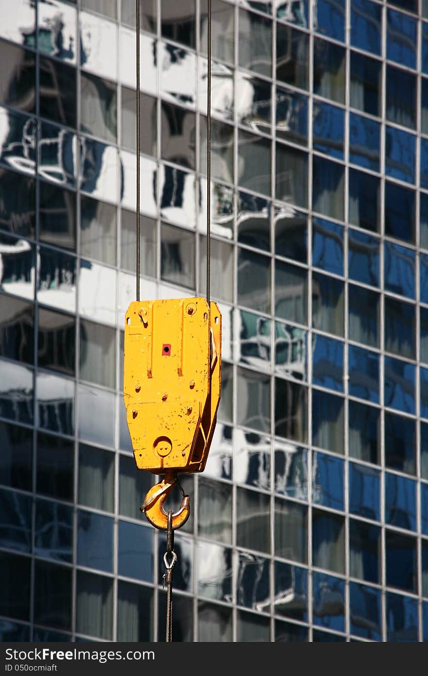 Yellow hook from the crane on construction site. Yellow hook from the crane on construction site