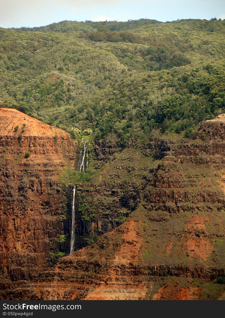 Waipo'o Falls plunges more than 800 feet down in Waimea Canyon, Kauai Island, Hawaii. Waipo'o Falls plunges more than 800 feet down in Waimea Canyon, Kauai Island, Hawaii.