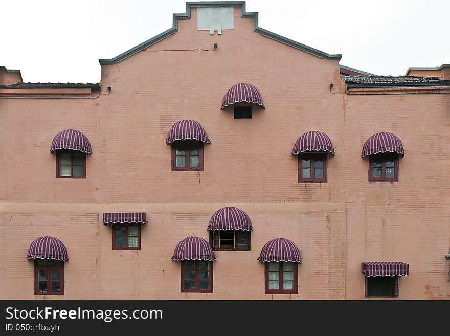 The facade of a building with arched sunshades