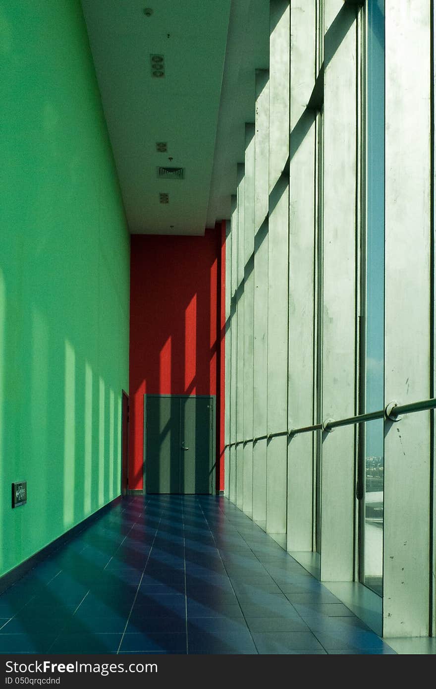 A corridor with sunshine from the glass curtain