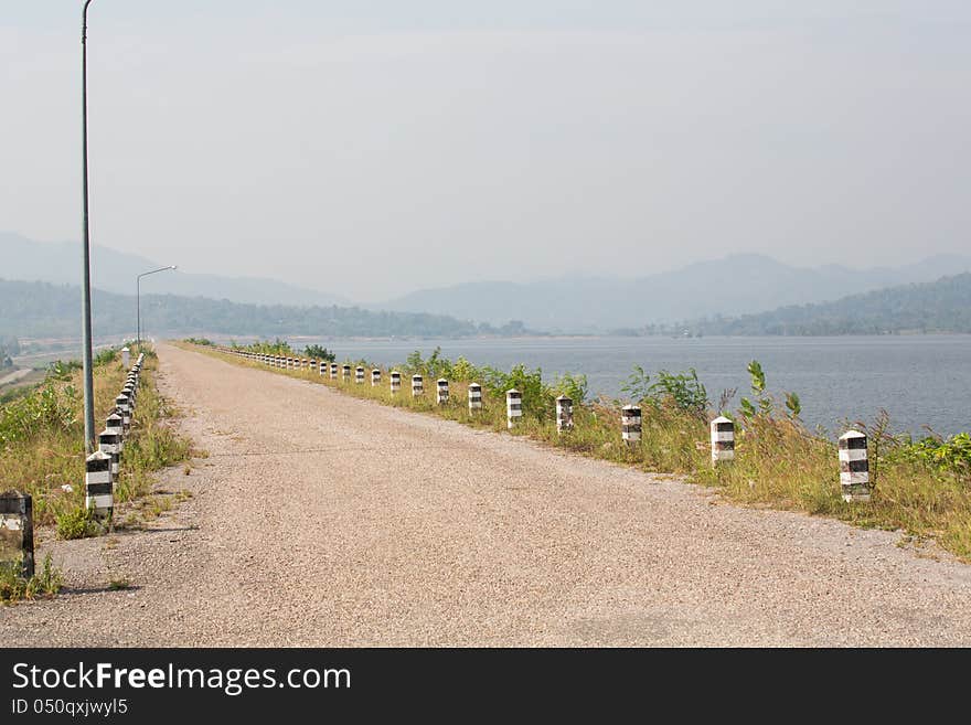 Dam road and lake in Thailand.