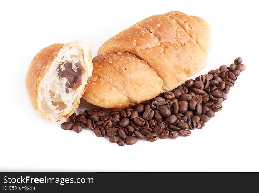 Croissant With Coffe Beans On White Background