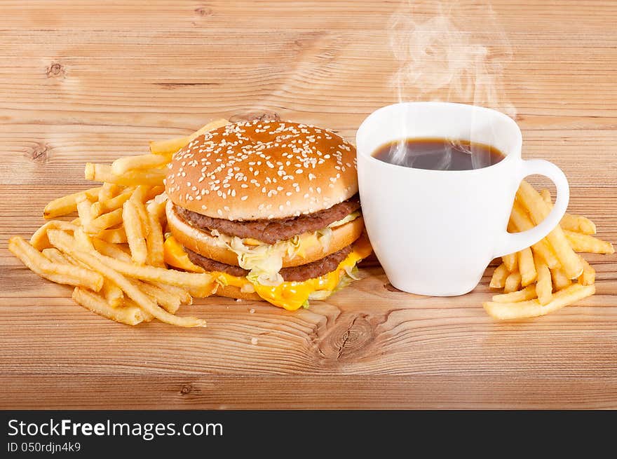 Breakfast Set: Coffee, Hamburger And French Fries On Wooden Background