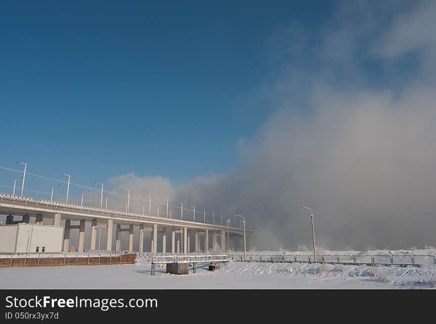 Bridge stretching into the fog.