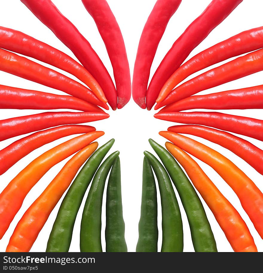 Colorful hot chillies arranged circularly isolated on white background. These farm fresh chilies are in red, orange, yellow and green colors. Colorful hot chillies arranged circularly isolated on white background. These farm fresh chilies are in red, orange, yellow and green colors.