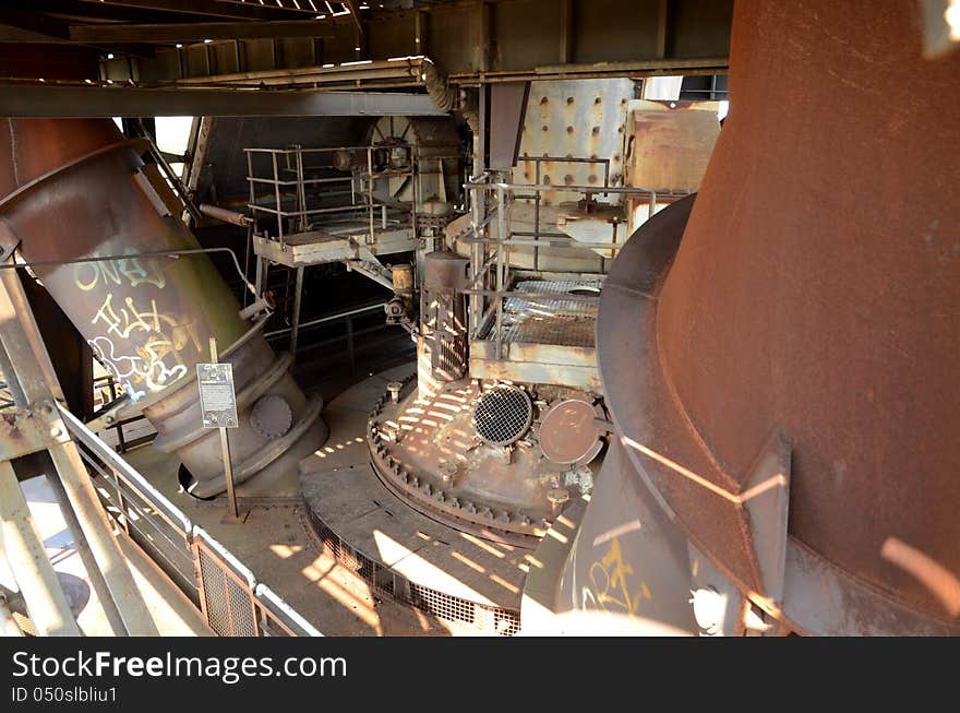 An old furnace in a steel production facility. An old furnace in a steel production facility.