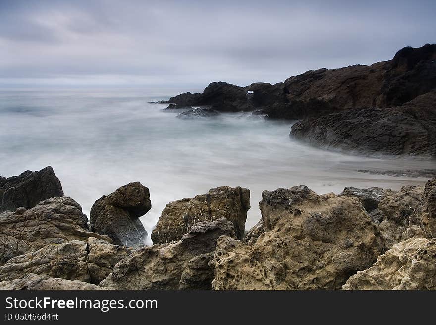 Exposure of a coastal tide surging through a cove. Exposure of a coastal tide surging through a cove.