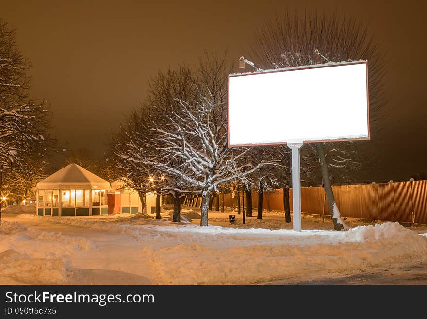 Fabulous night winter landscape, snow-covered trees and road