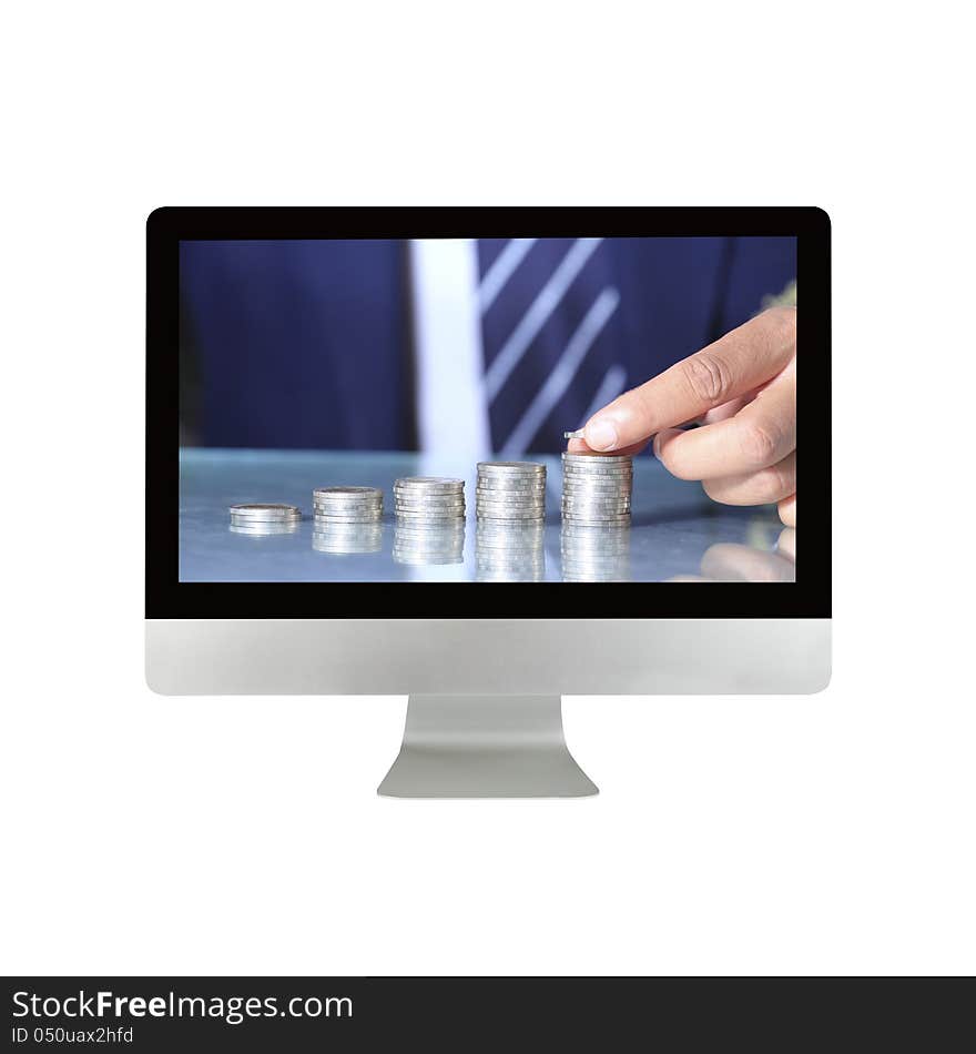 Businessman hand put coins in computer monitor