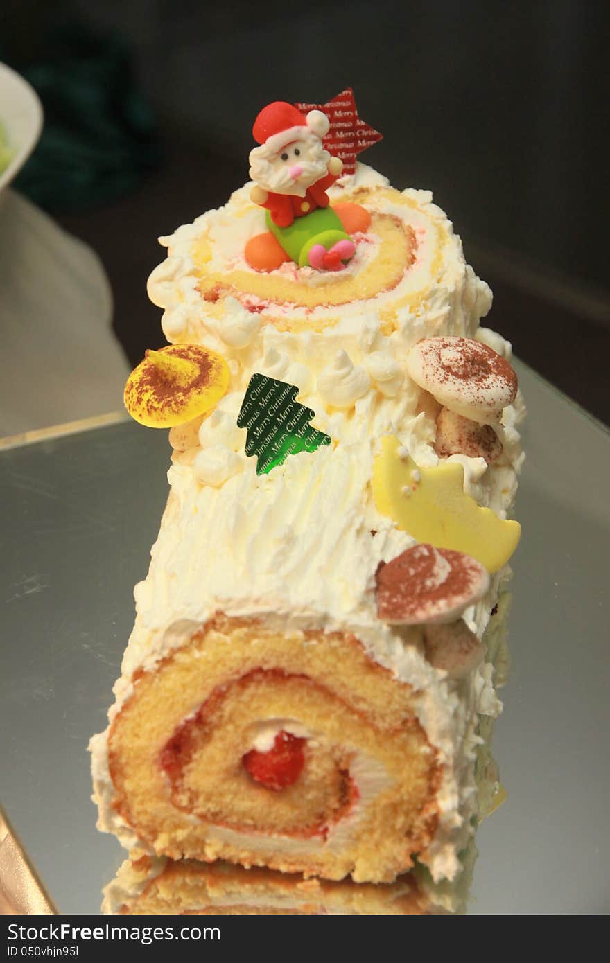 Close up of cake with Santa doll. Close up of cake with Santa doll