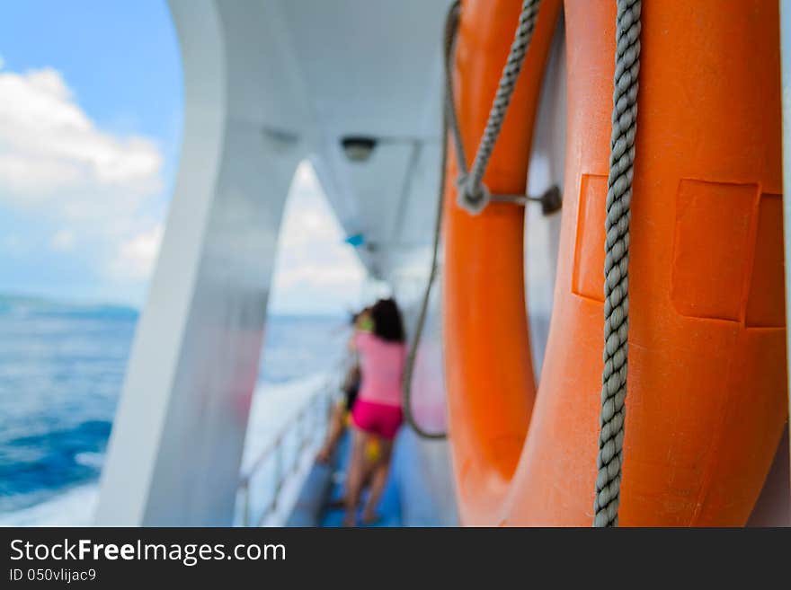 A lifebuoy ring is hanging on the cruise