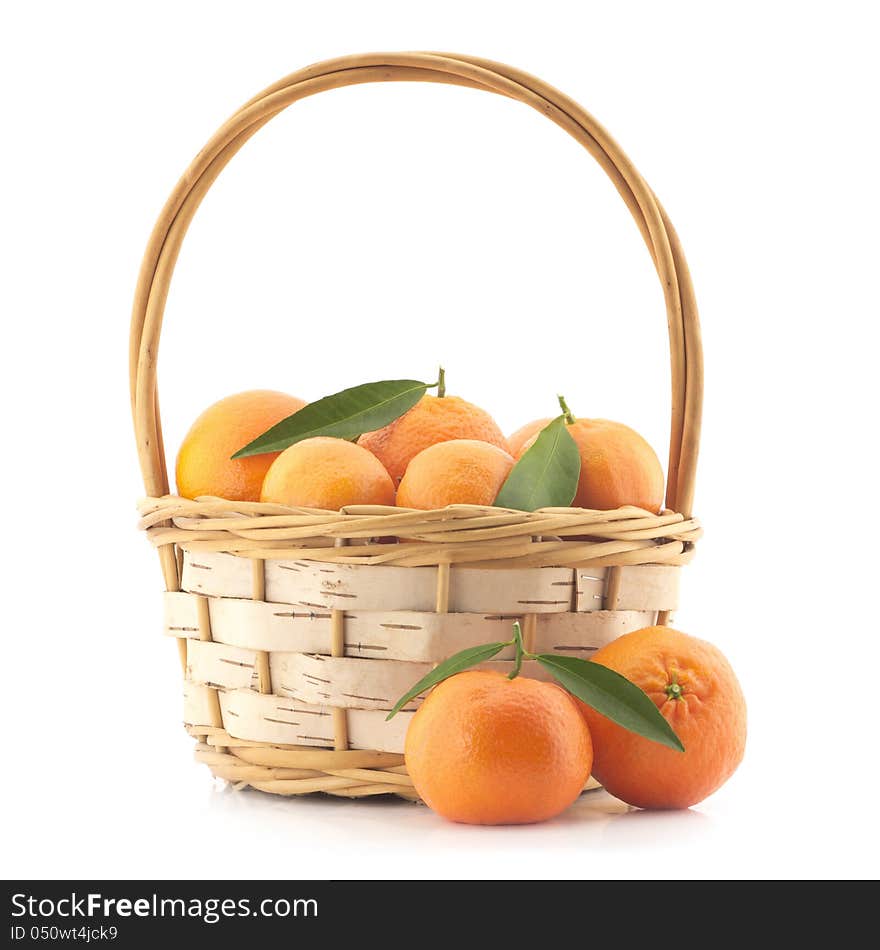 Tangerines with leaves in a basket