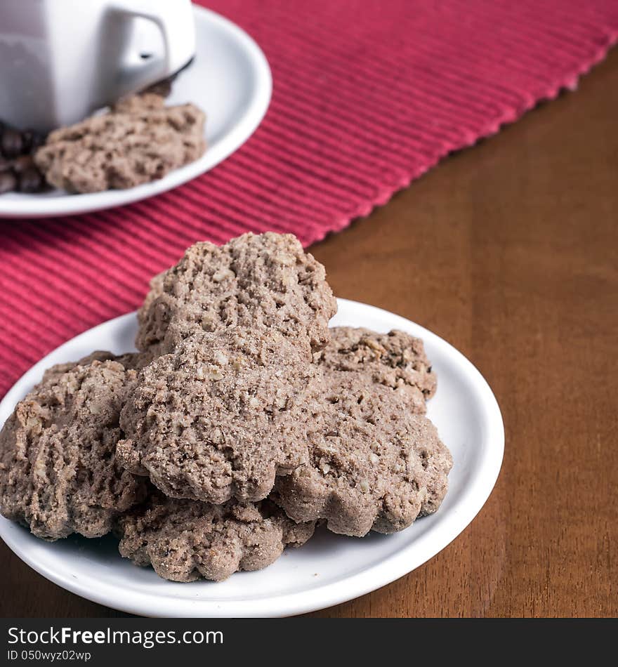 Cookies in a plate on wooden table