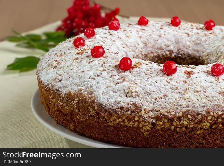 Piece of cake on a white plate with berries