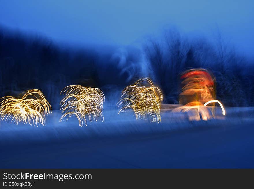 An Artistic background of Christmas trees at night