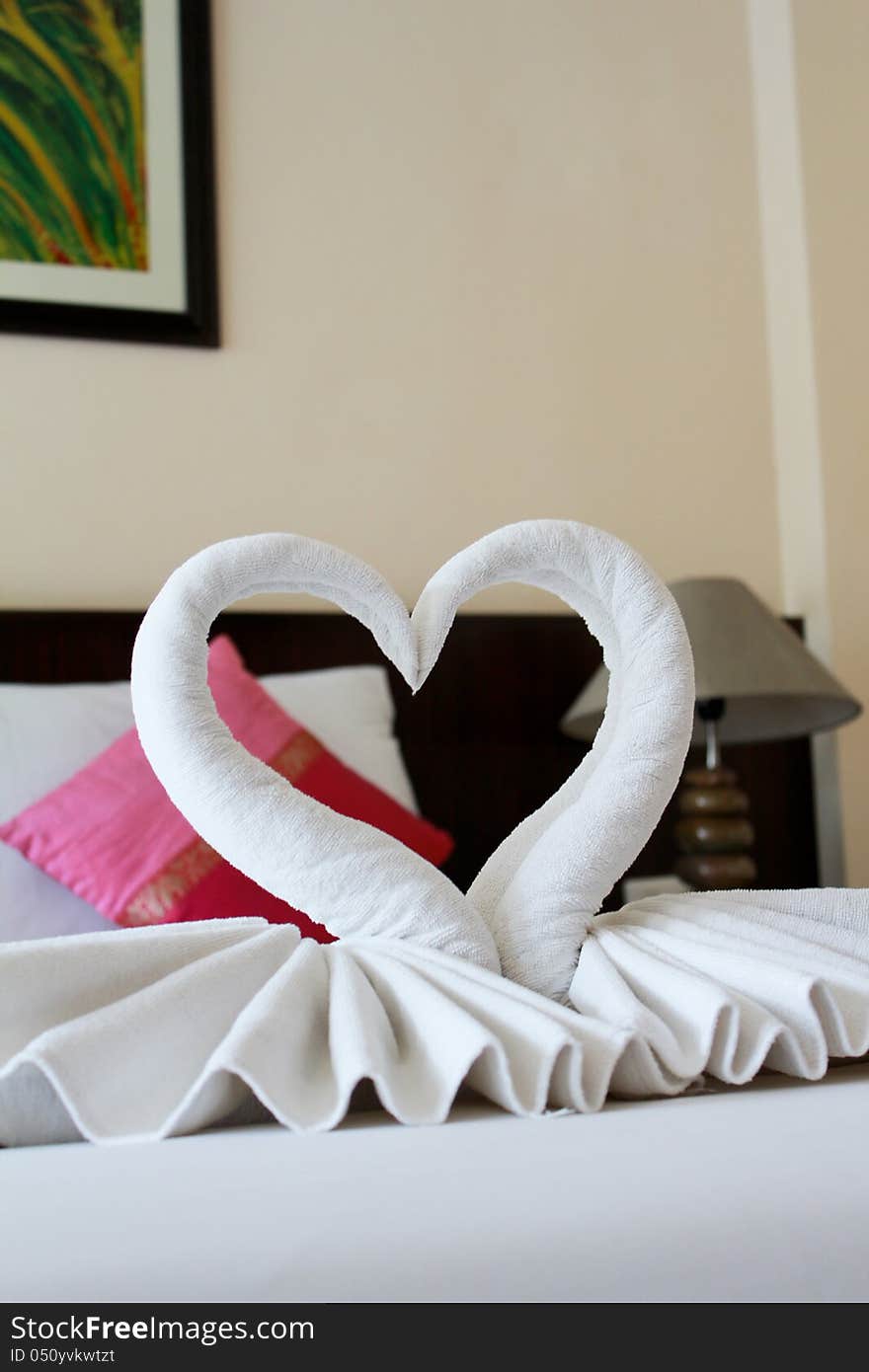 Folding towel swan on the bed, spa decoration