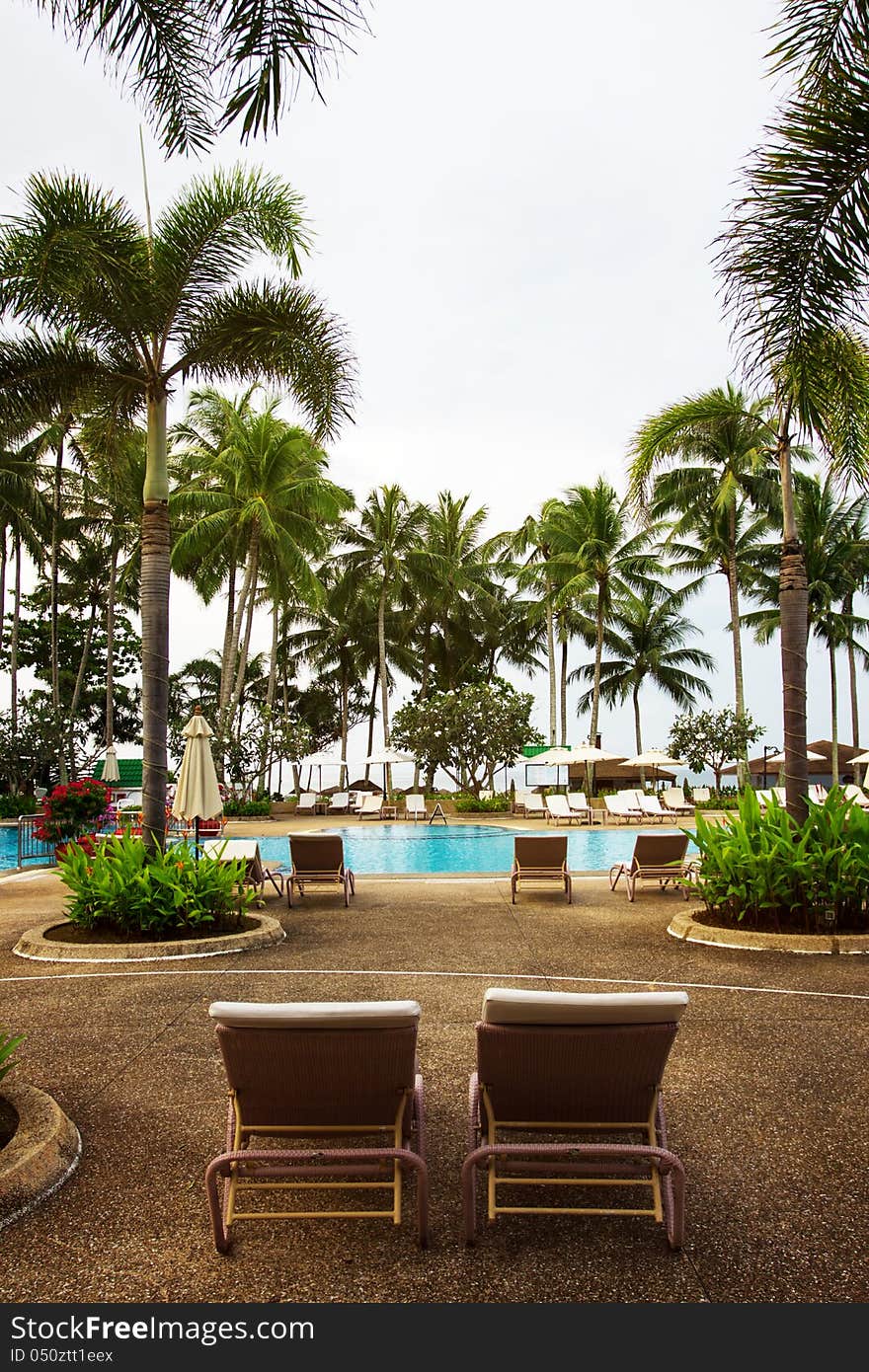 Swimming pool area, tropical resort, without people