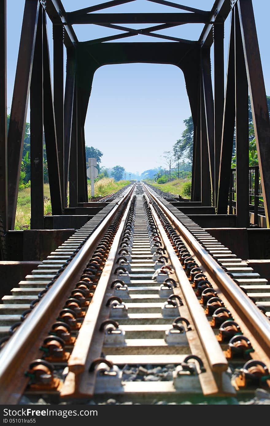 Metal rail road bridge over river