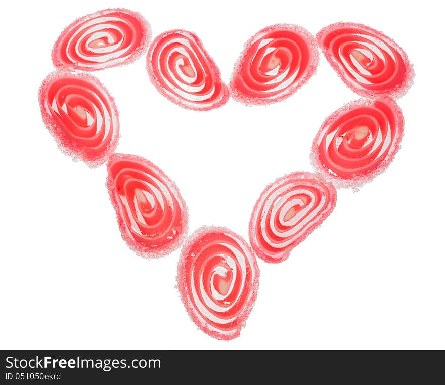 Candy fruit  coated candy hearts arranged in the shape of a heart, Isolated