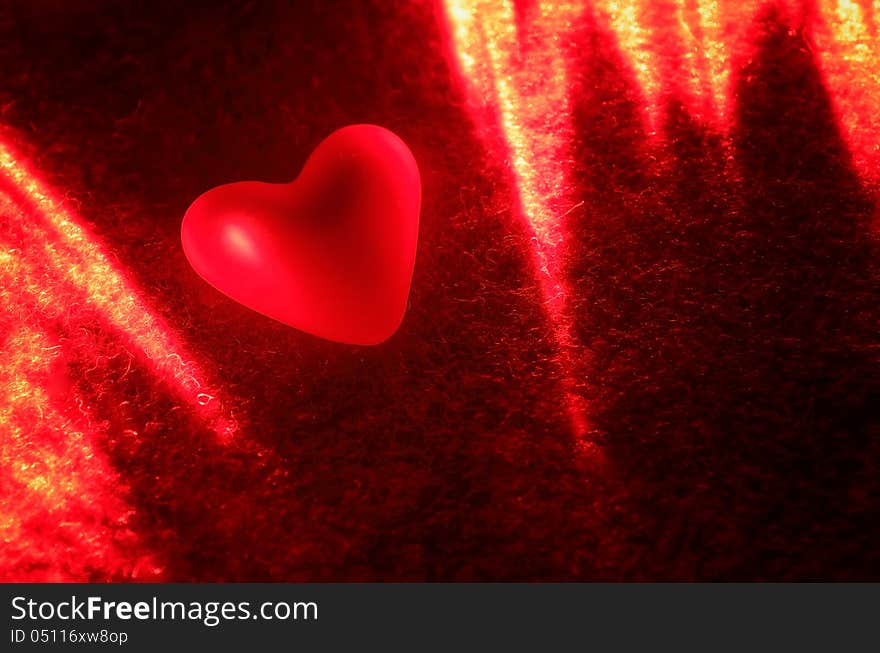 Heart in the light of the laser. Background Valentine's Day