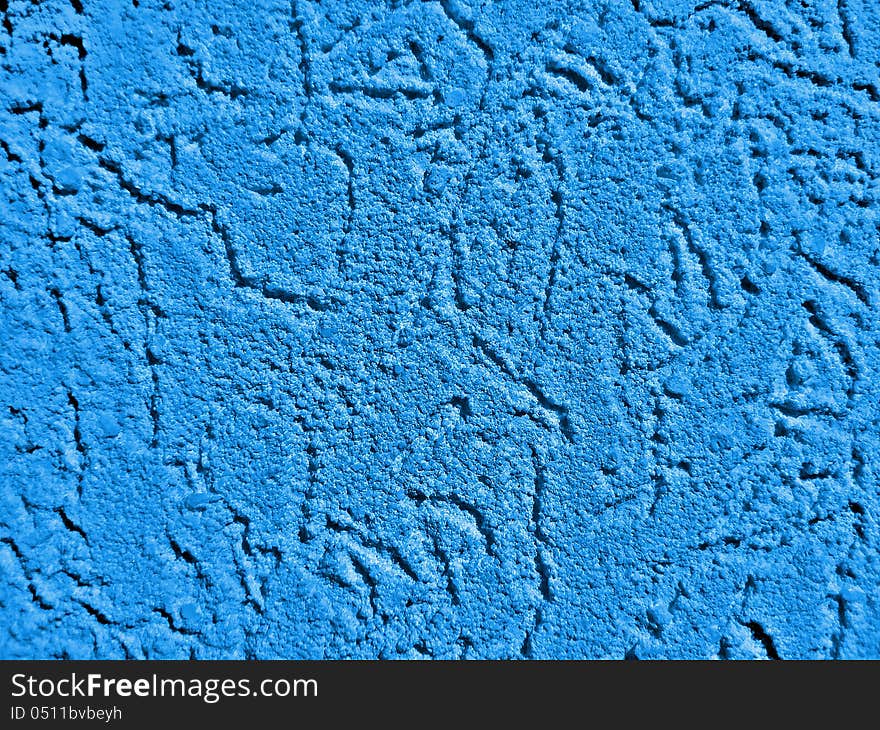 Blue surface of a wall with textured plaster. Blue surface of a wall with textured plaster