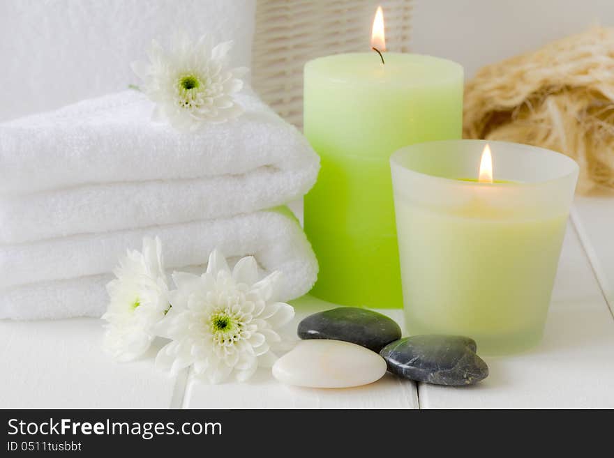 Wellness paraphernalia, soft towels, therapy stones and candles. Wellness paraphernalia, soft towels, therapy stones and candles