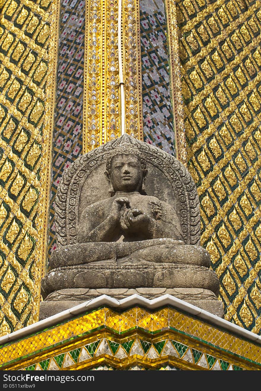 Stone buddha statue in front of buddha palace at wat Phra kaew, Thailand