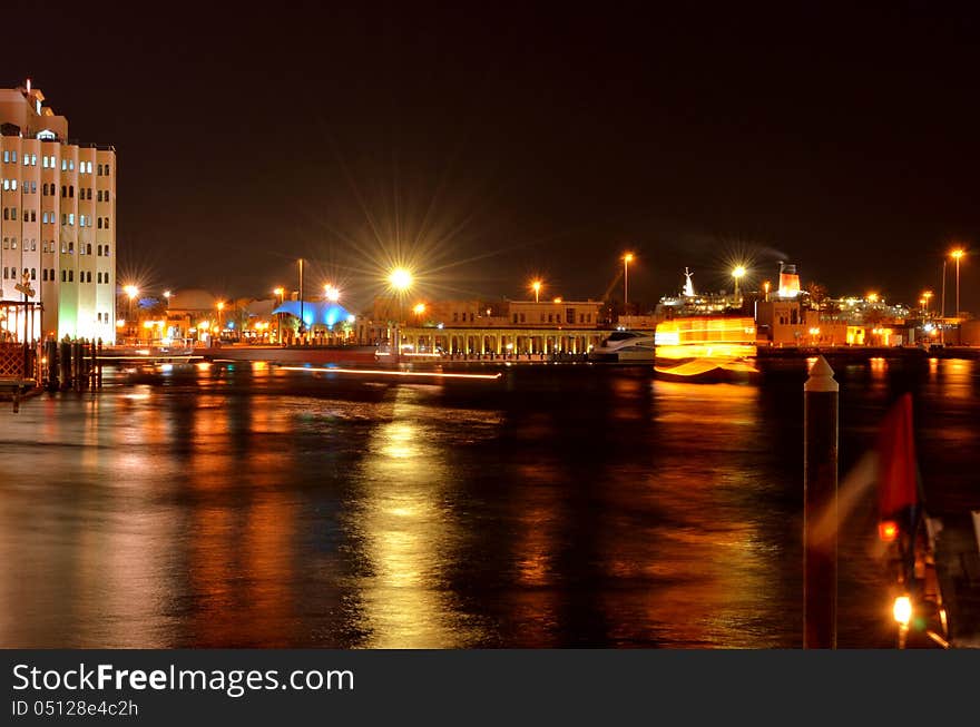 The restaurants and hotel at Bur Dubai creek, smoke coming out of chimney and glittering lights and silky water adds a look to this photo though it was an ordinary location. The restaurants and hotel at Bur Dubai creek, smoke coming out of chimney and glittering lights and silky water adds a look to this photo though it was an ordinary location.