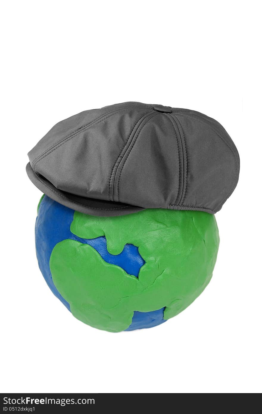 Plasticine globe earth and man's hat on a white background. Plasticine globe earth and man's hat on a white background