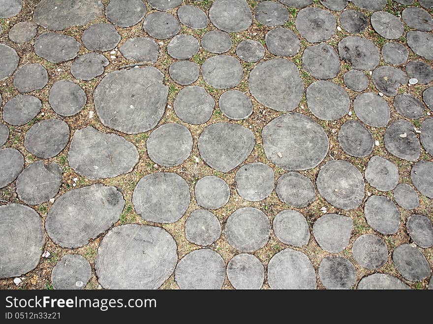 Wooden logs buried in the ground as a base for walking. Wooden logs buried in the ground as a base for walking