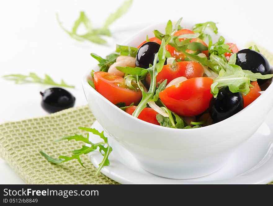 Healthy beans salad on a white plate