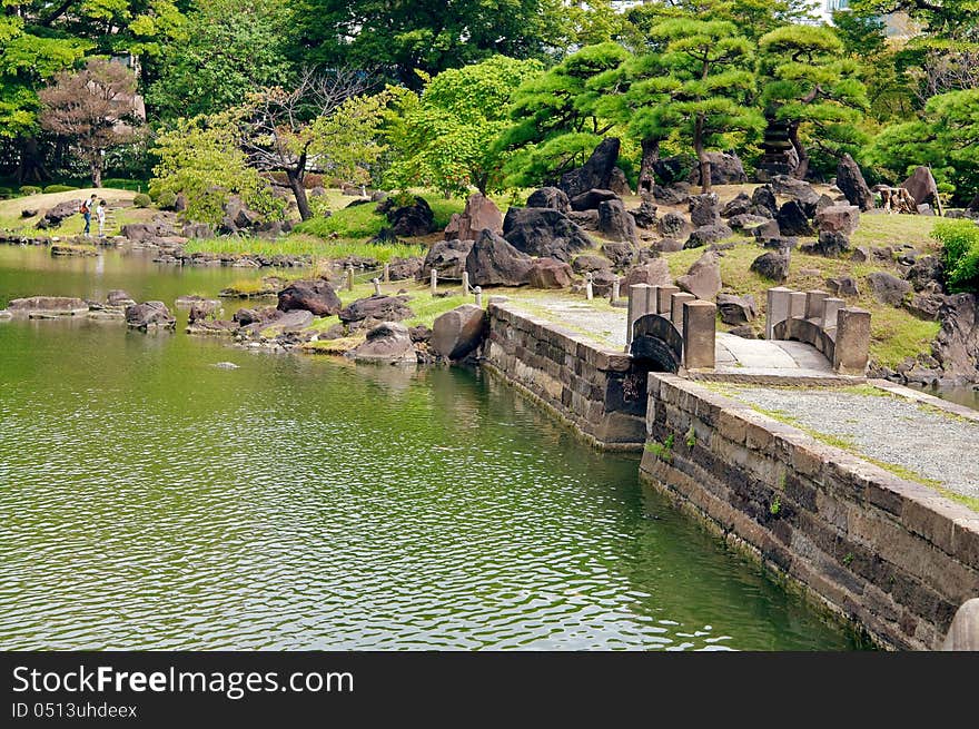 Formal garden, man made, color image, ornamental garden, residential garden, beauty in nature, Japan culture, wilderness area, national landmark, residential district, Japanese garden, rock garden, bridge across pond. Formal garden, man made, color image, ornamental garden, residential garden, beauty in nature, Japan culture, wilderness area, national landmark, residential district, Japanese garden, rock garden, bridge across pond