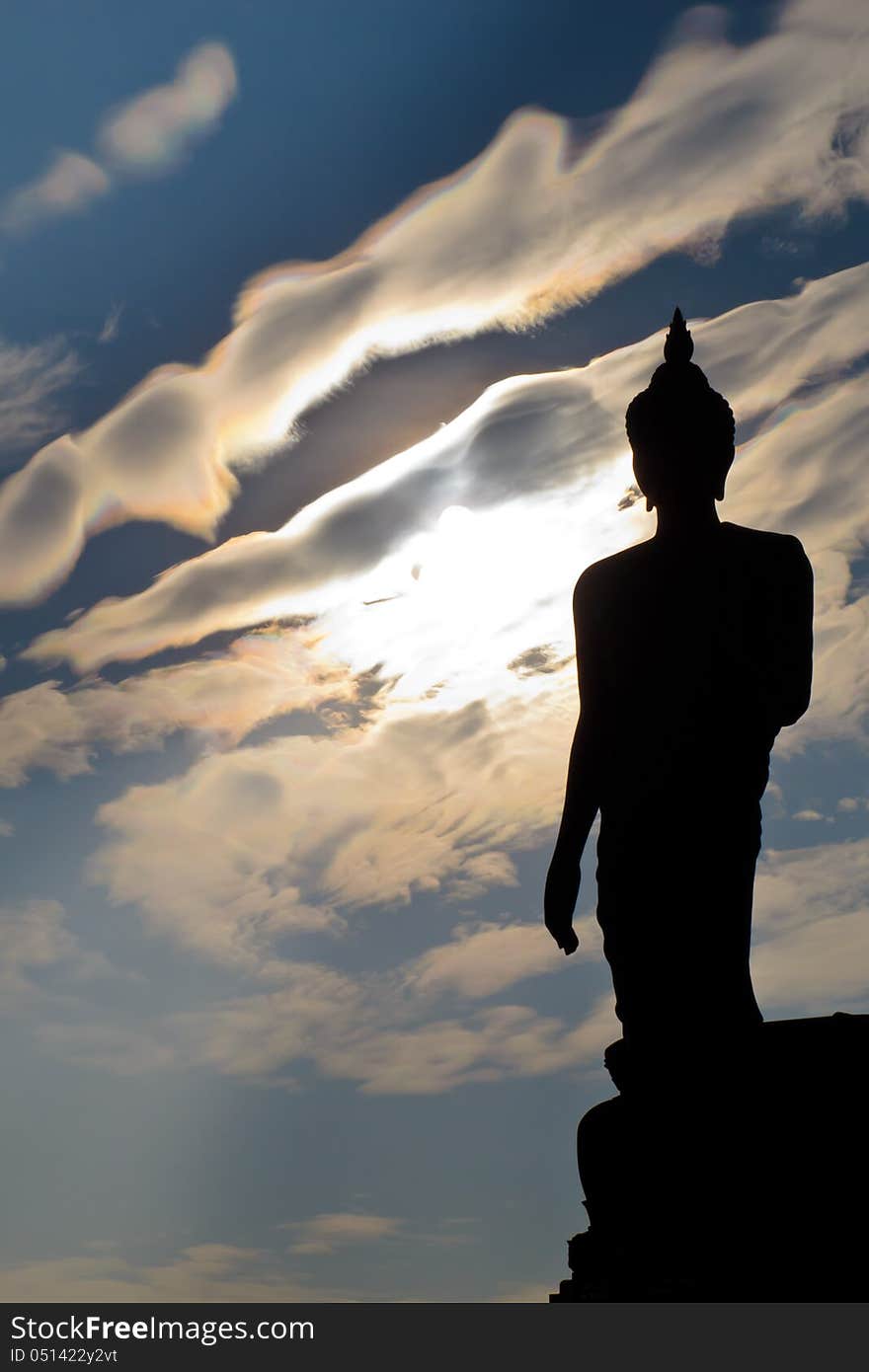 Silhouette of buddha statue with white cloud at Phutthamonthon, Thailand