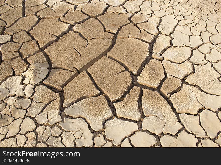 Cracked clay ground into the dry season. Cracked clay ground into the dry season