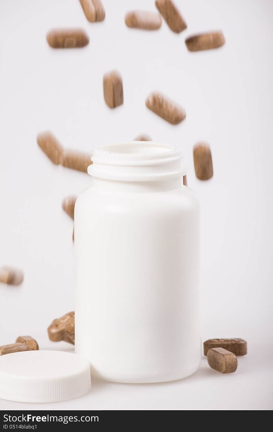 White medicine bottle on white background