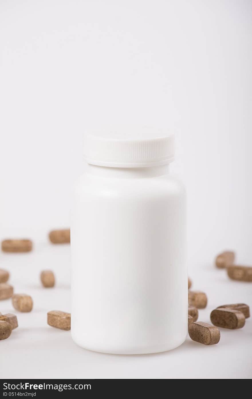 White medicine bottle on white background